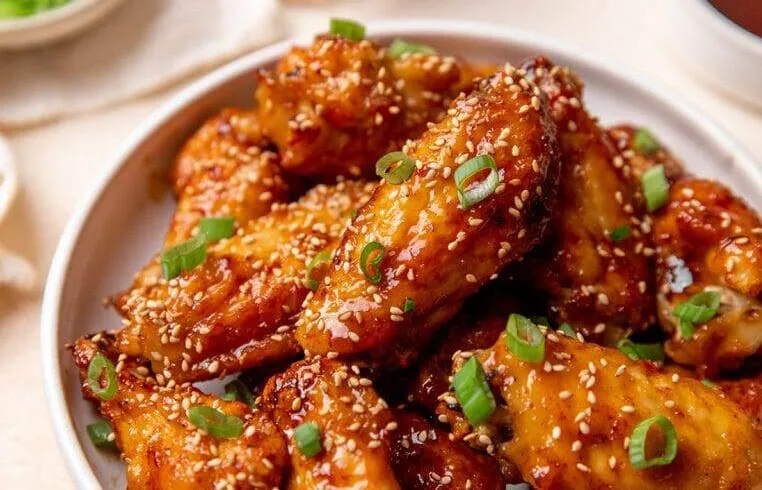 Delicious Honey Garlic Chicken Wings dish at Calgary Calzones Wings & Salad in Calgary, AB