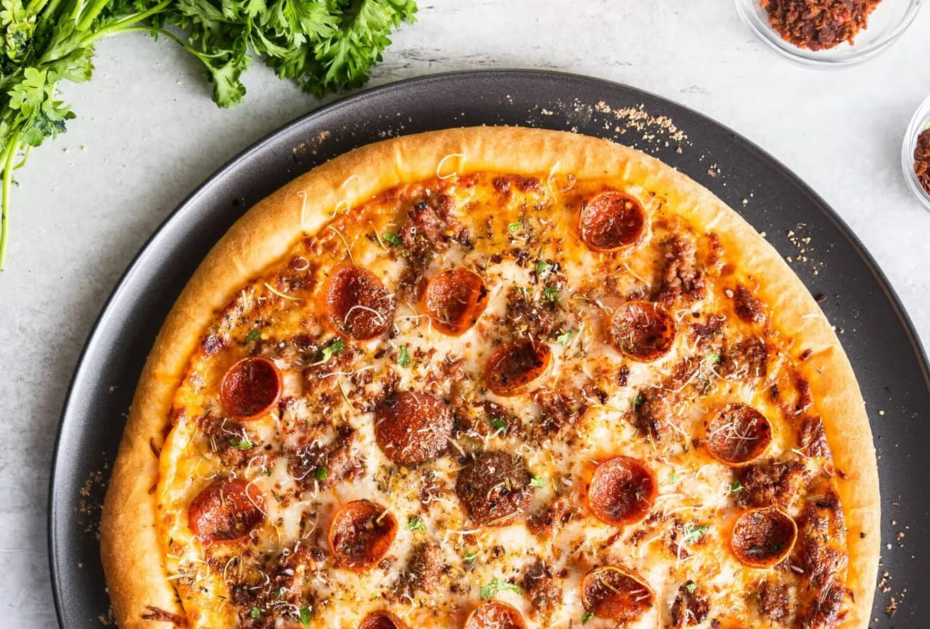 Delicious Meat Lovers Pizza in Calgary Calzones Wings & Salad, Calgary, AB